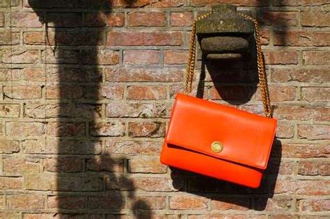 New in: Céline coin tas in vermillion .